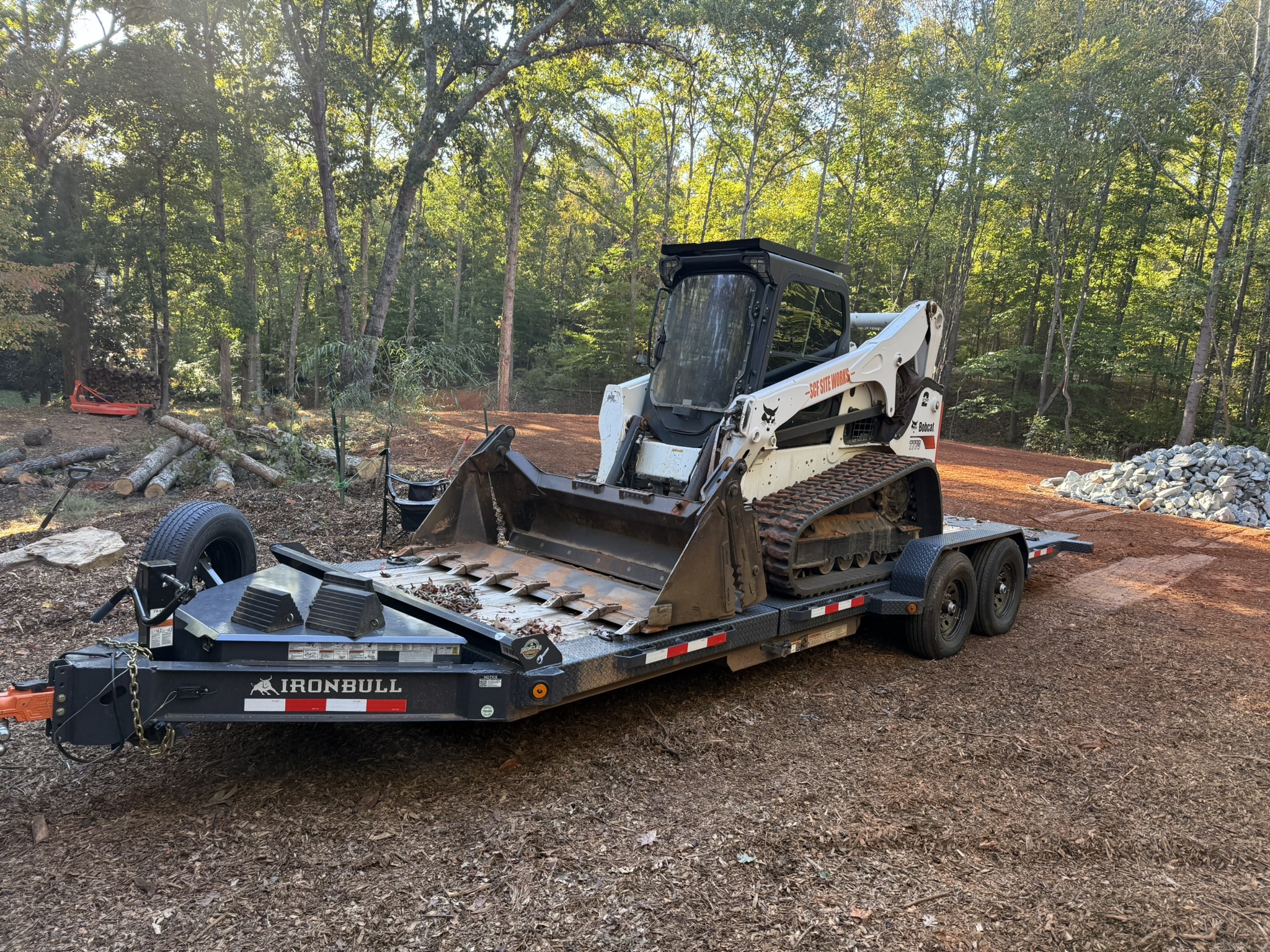 IronBull tilt trailer hauling compact track loader - Professional trailer rental near Charlotte NC