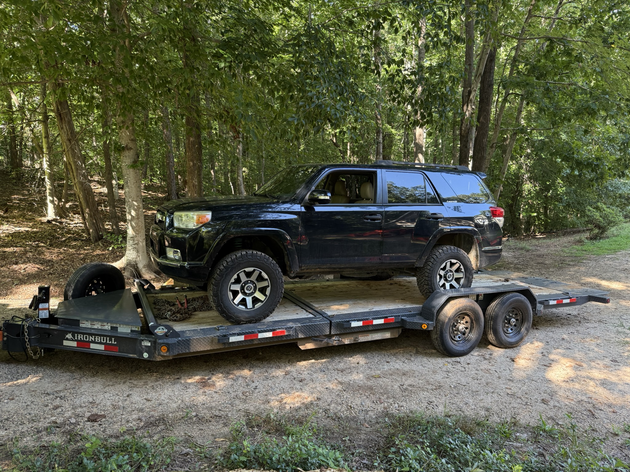 Tilt deck trailer carrying Toyota 4Runner - Vehicle transport trailer rental in the Carolinas